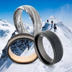 3 Black Rings for Men against Snowy Mountain Background